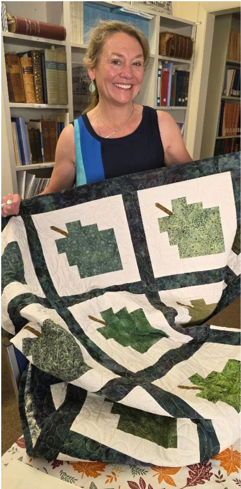 Woman holding quilt